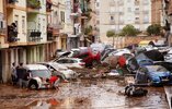 residents-look-cars-piled-swept-945107699.jpg